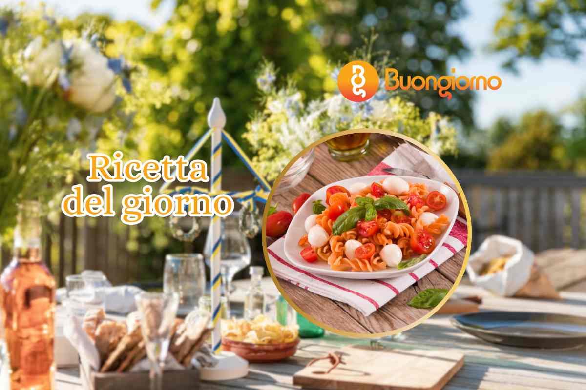 tavola apparecchiata pasta con pomodorini e mozzarella