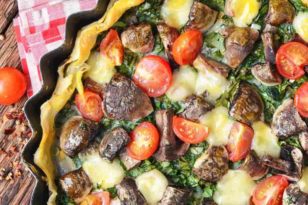 torta salata con melanzane pomodori e mozzarella